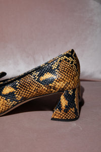 Pumps con Effetto Serpente Rochas