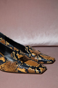 Pumps con Effetto Serpente Rochas